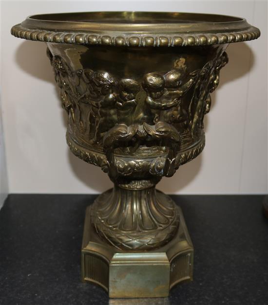 A large gilt bronze two handled oval vase, moulded with continuous bacchanalian scene, height 14.75in.